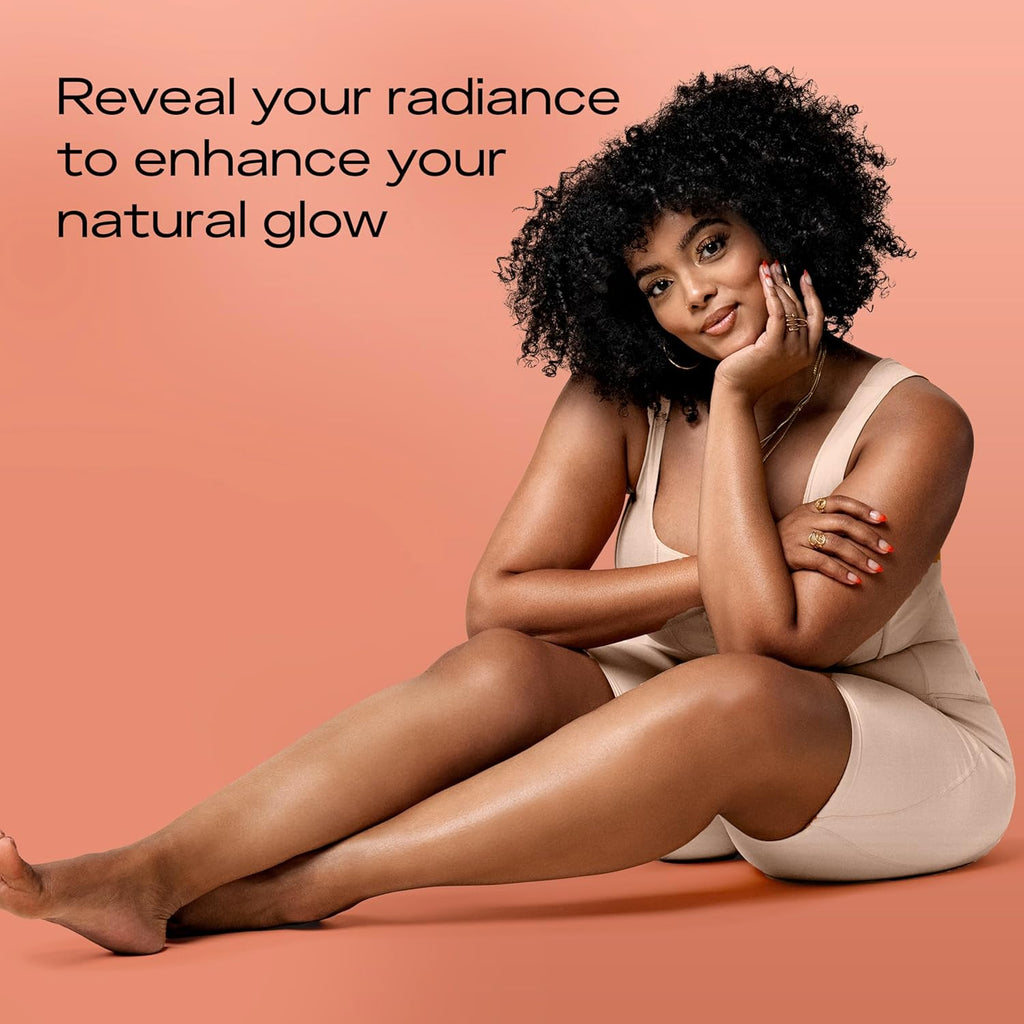 Woman sitting on a peach-colored background with text about enhancing natural glow