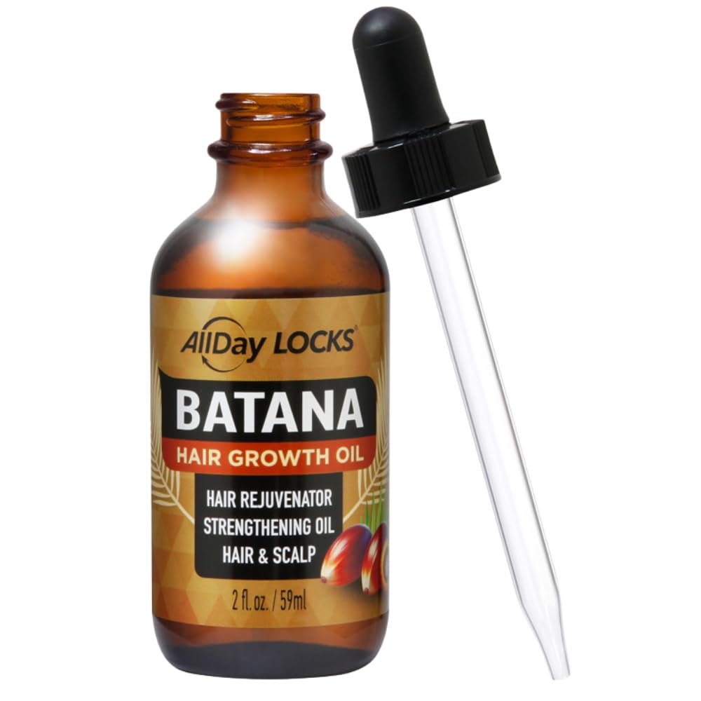 Dropper of Batana Hair Growth Oil ready to apply
