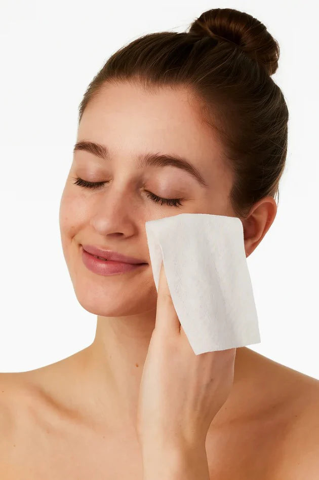 Model drying face with Spascriptions Fresh Dry Facial Towels