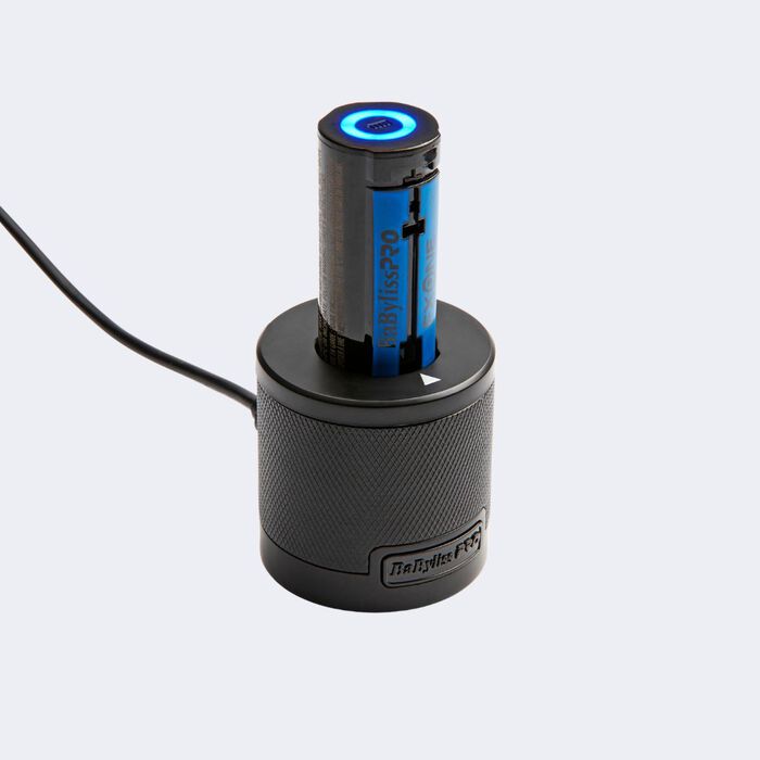 Black electronic device with blue light on a white background