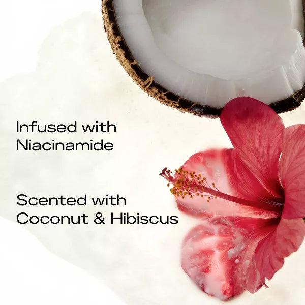 Coconut bottle with pink flower and text about niacinamide and coconut & hibiscus scent.