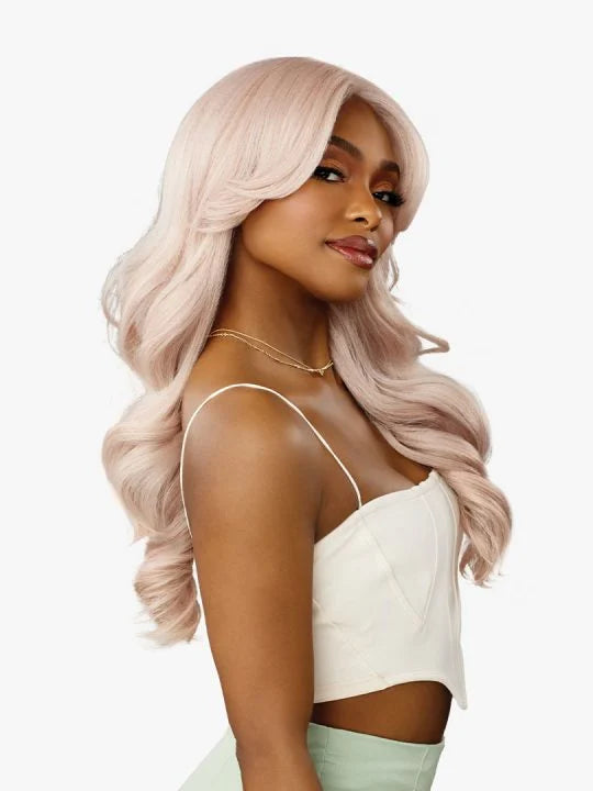 Celestia V-Part Wig styled with loose body waves on model
