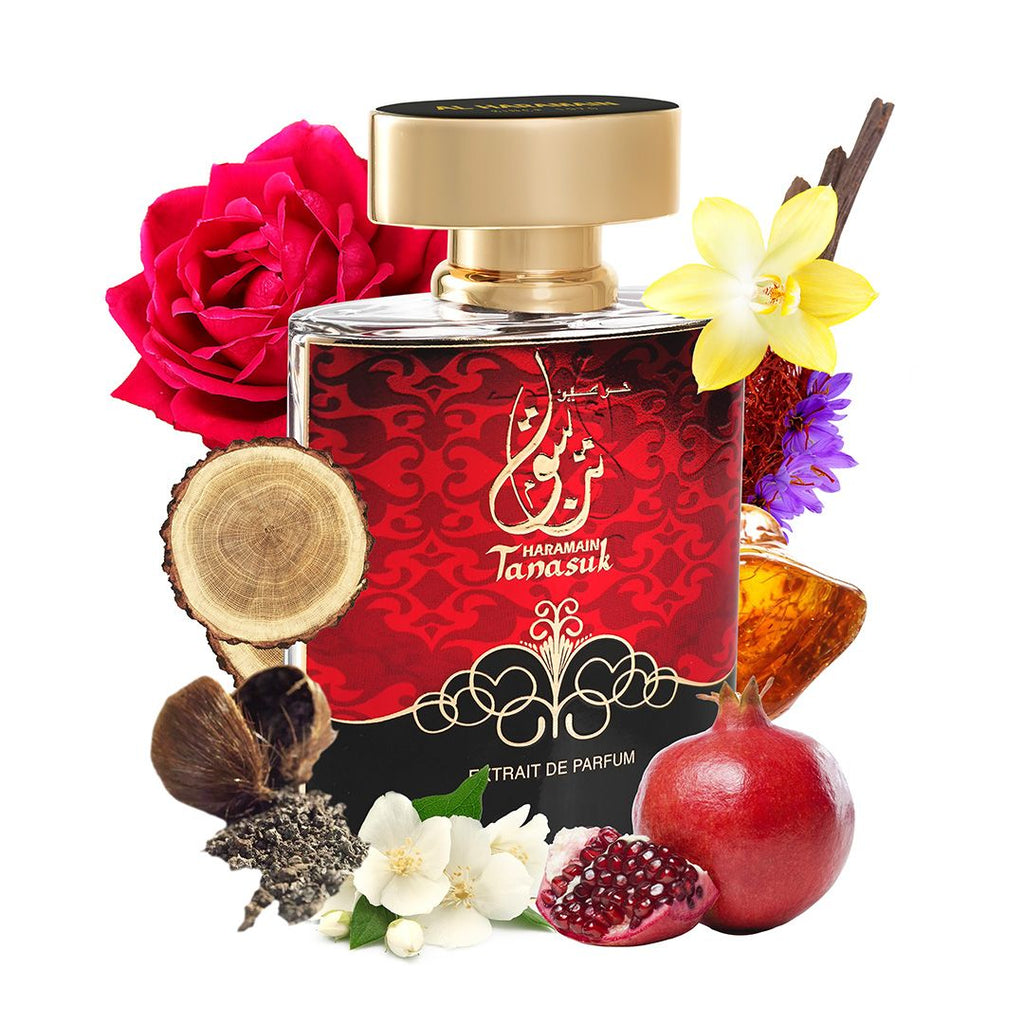 Perfume bottle with floral and fruit elements on a white background