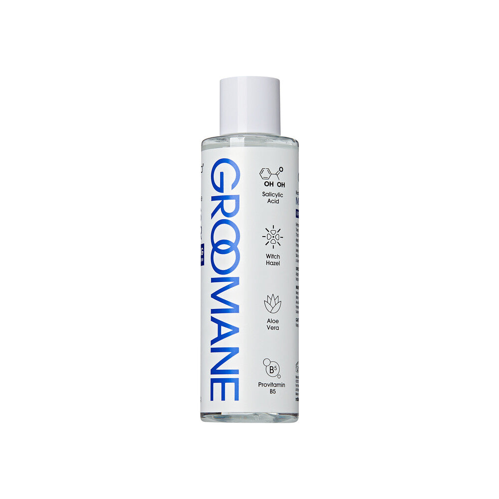 Groomane bottle on a white background