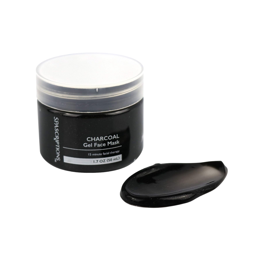 Black jar of charcoal gel face mask with a spoonful of mask on a white background