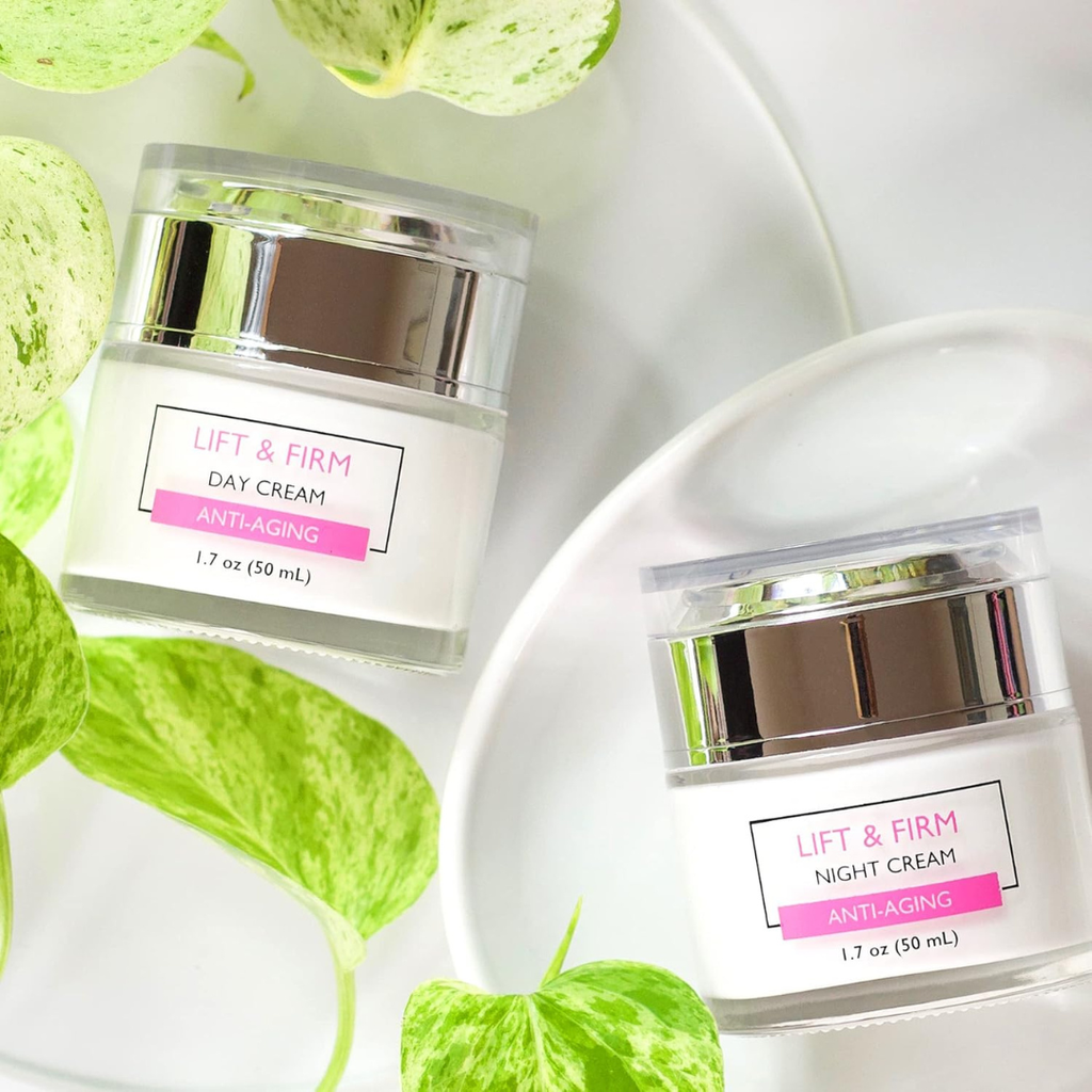 Two skincare cream jars labeled 'Lift & Firm' on a white background with green leaves.